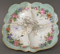 A Continental porcelain entree dish, the four section florally painted,