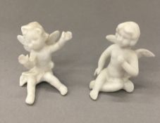 A pair of porcelain cake decorations