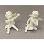 A pair of porcelain cake decorations