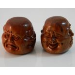 Two wooden four faced Buddha heads