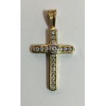 An 18 ct gold diamond set cross (3 grammes total weight)