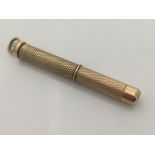 A 9 ct gold toothpick (6.