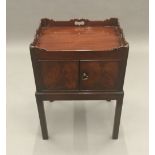 A George III style mahogany bedside cupboard