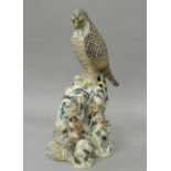 A 19th century Japanese pottery model of a falcon