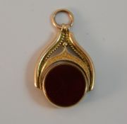 A 9 ct gold bloodstone and carnelian swivel fob (6.