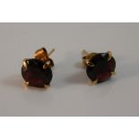 A pair of 9 ct gold and garnet earrings