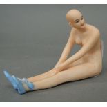 A porcelain figure of a nude lady