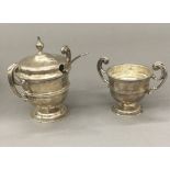 A silver mustard and a miniature silver trophy cup (4.