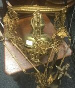 A Victorian gilt metal hanging oil lamp and a brass companion set