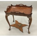 An Edwardian 18th century style mahogany silver table,