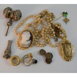 A quantity of costume jewellery, a silver rattle, etc.