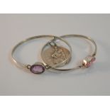 Two silver bangles and a St Christopher pendant