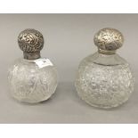 Two silver topped cut glass scent bottles