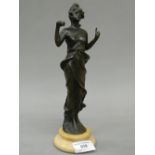 A patinated bronze figurine