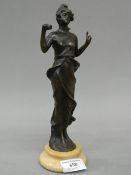 A patinated bronze figurine