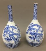A pair of 19th century Japanese blue and white porcelain bottle vases