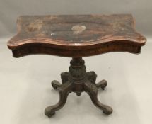 A Victorian burr walnut Serpentine card table
