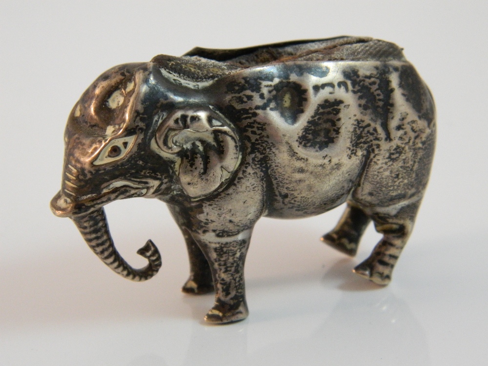 An Edwardian silver elephant form pin cushion