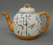 A 19th century Staffordshire teapot with faux bamboo decoration