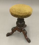 A Victorian revolving piano stool