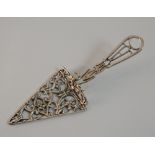 A miniature silver trowel