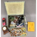 A box of miscellaneous items, including jewellery, Corgi toys, a vesta, etc.