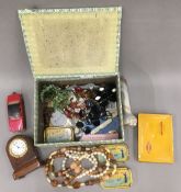 A box of miscellaneous items, including jewellery, Corgi toys, a vesta, etc.