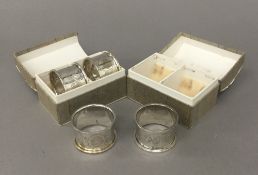 Four boxed silver napkin rings (59 grammes)