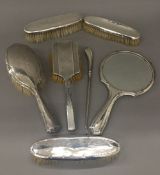 A quantity of silver dressing table items.
