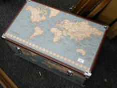 A set of trunks decorated with maps