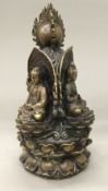 A Chinese bronze shrine set with three forms of Buddha