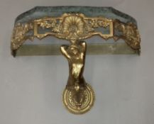 A marble topped brass wall mounted console table