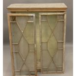 A 19th century pine glazed cabinet