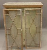 A 19th century pine glazed cabinet