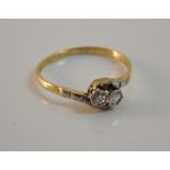 An 18 ct gold and diamond crossover ring (2 grammes total weight)