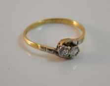 An 18 ct gold and diamond crossover ring (2 grammes total weight)