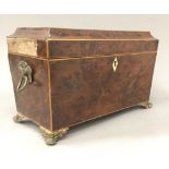 A George III burr yew wood sarcophagus form tea caddy