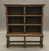 An oak open bookcase. 126 cm wide, 145 cm high, 31 cm deep.