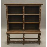 An oak open bookcase. 126 cm wide, 145 cm high, 31 cm deep.