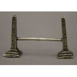 A late 19th/early 20th century knife rest formed as two obelisks