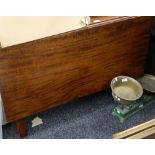 An early 19th century mahogany drop leaf table.