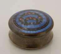 A small silver and enamel box. 4.5 cm wide, 2 cm high.