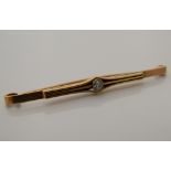 A 9 ct gold and diamond bar brooch (5.