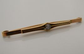 A 9 ct gold and diamond bar brooch (5.