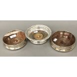 Three silver plated bottle coasters