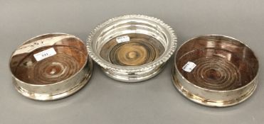 Three silver plated bottle coasters