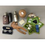 A quantity of miscellaneous items, including a hip flask, nutcracker, etc.