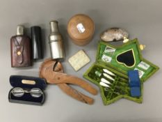 A quantity of miscellaneous items, including a hip flask, nutcracker, etc.