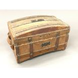 A vintage French chocolate box formed as a travelling trunk