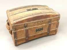 A vintage French chocolate box formed as a travelling trunk